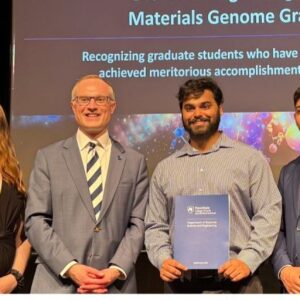 Debjyoti Bhattacharya's award photo with Prof. John Mauro